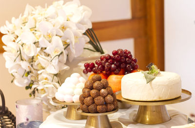 Various fruits in plate on table