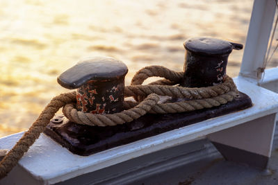 Close-up of rope tied on metal