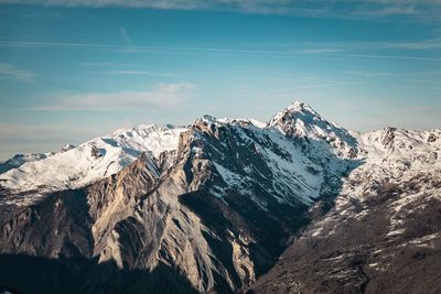 Scenic view of snowcapped mountains against sky