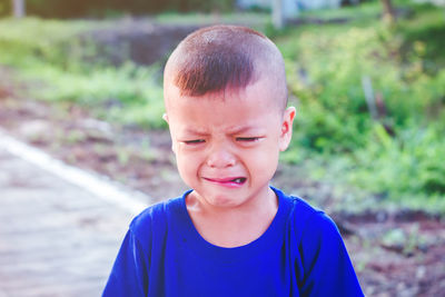 Boy looking away while crying