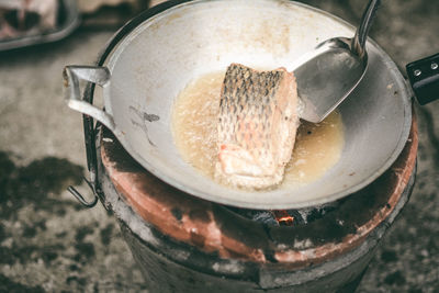 High angle view of meat frying in container