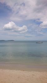 View of calm sea against cloudy sky