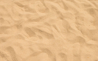 High angle view of paper on sand