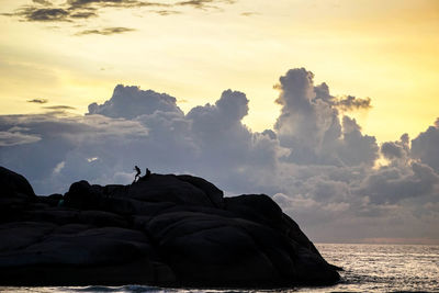 Scenic view of sea against sky at sunset