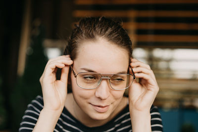 Close-up of beautiful young woman wearing eyeglasses