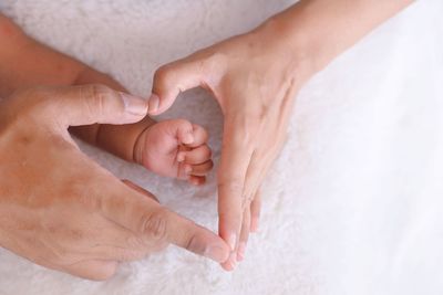 Low section of man washing hands