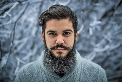 Portrait of young bearded man during winter