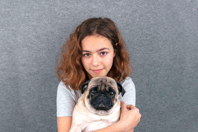 Portrait of young woman with dog