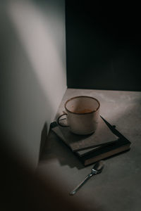 Close-up of coffee on table with books