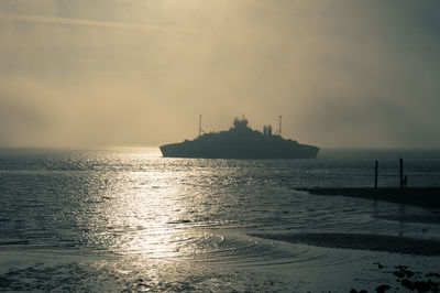 Scenic view of sea against sky at sunset