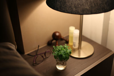 Close-up of illuminated lighting equipment on table at home