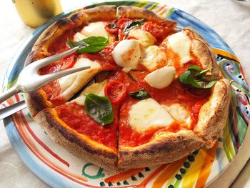 High angle view of pizza served in plate