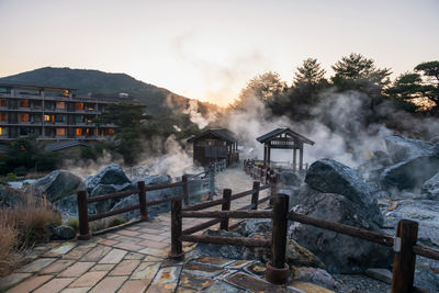 Mount unzen hell valley jigoku and hotel after sunset with heavy gas steam, nagasaki, kyushu, japan.