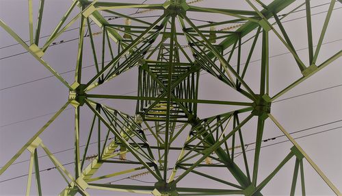 Low angle view of metallic structure against sky