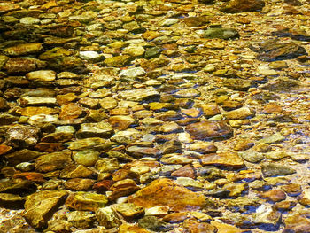 Full frame shot of stones in water