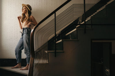 Woman standing on staircase