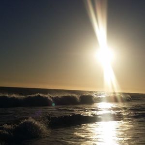 Scenic view of sea against clear sky during sunset