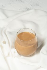 High angle view of coffee on bed