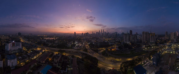 High angle view of city buildings during sunset