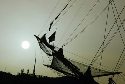 Low angle view of silhouette people against sky during sunset