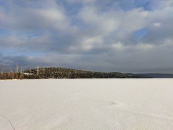 Scenic view of landscape against sky during winter