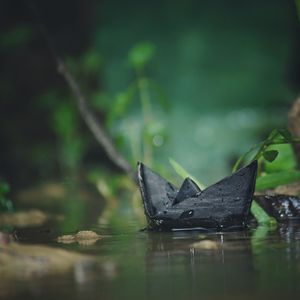 Close-up of paper boat in water