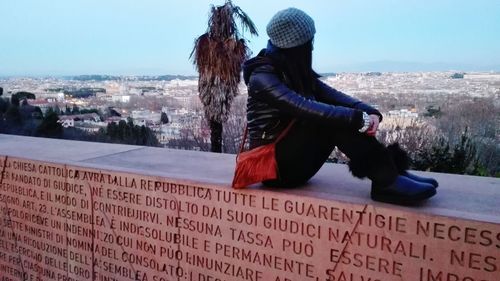 Full length of woman standing in city