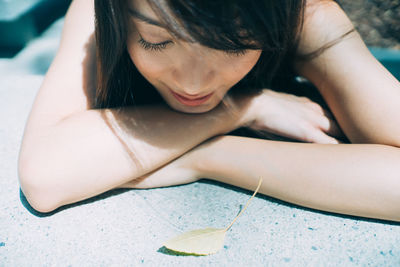 Close-up of young woman lying down