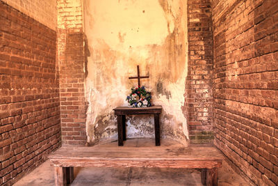 Cross on wall of historic building