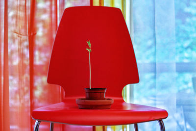 Close-up of empty red table and chairs in cafe