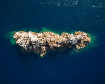 High angle view of rocks and sea