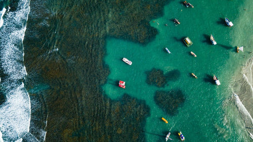 High angle view of rocks on sea shore