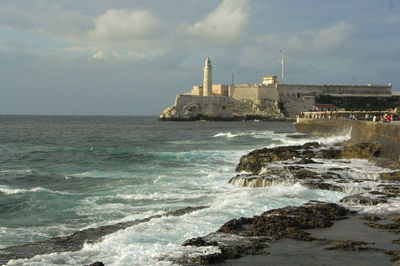 Scenic view of sea against cloudy sky