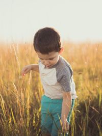 Boy standing on field