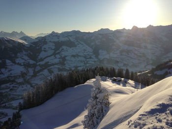 Scenic view of snowcapped mountains against clear sky