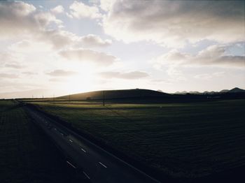 Scenic view of field against sky during sunset