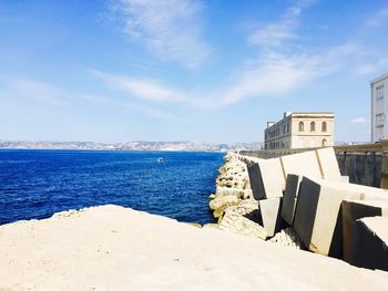 Scenic view of sea against cloudy sky