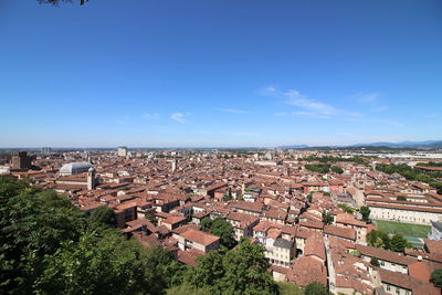 High angle view of townscape against blue sky