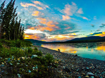 Scenic view of lake at sunset