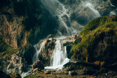 A beautiful waterfall flowing over the mossy rocks