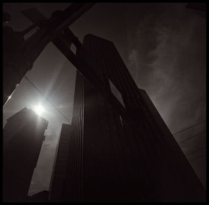 Low angle view of illuminated building against sky