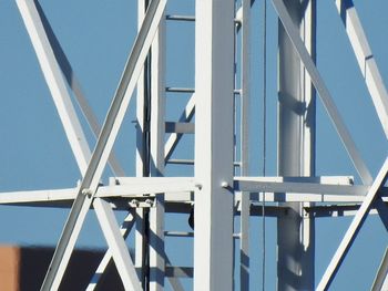 Low angle view of bridge against clear blue sky