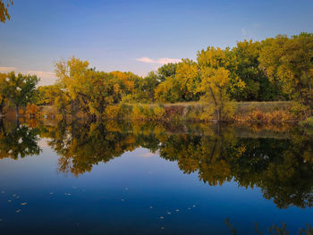 Scenic view of lake against sky during autumn