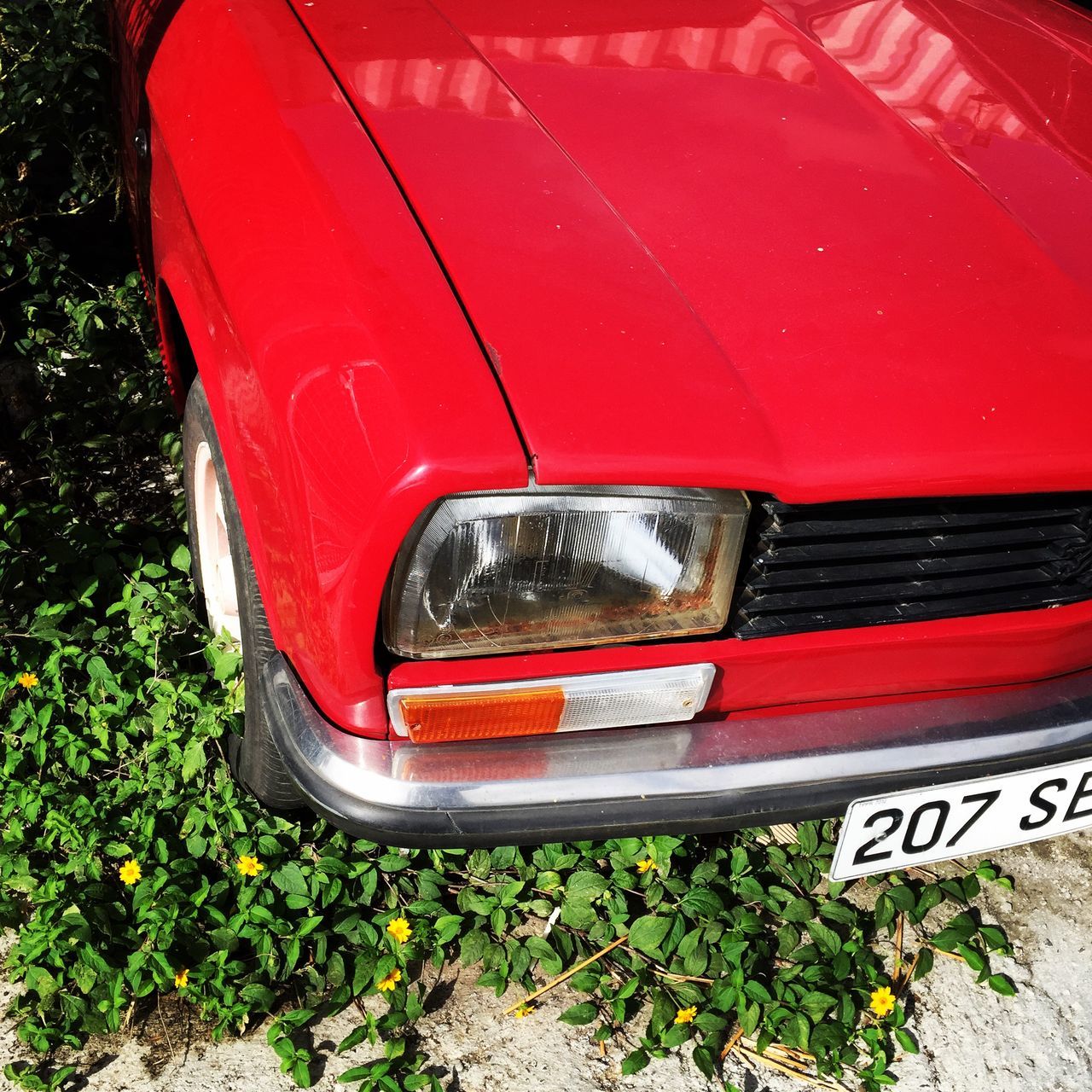 transportation, mode of transport, land vehicle, car, red, grass, abandoned, travel, high angle view, outdoors, day, close-up, part of, no people, wheel, metal, road, railroad track, stationary, vintage car