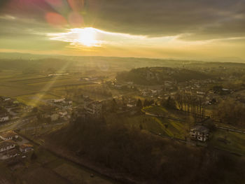 High angle view of city against sky during sunset