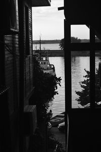 Scenic view of sea against sky seen through building