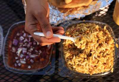 Cropped image of person holding food