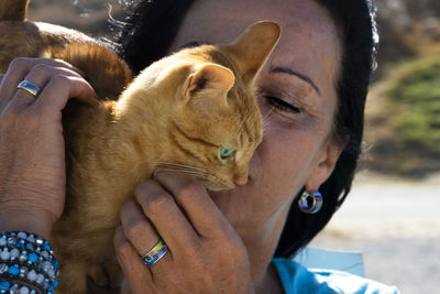 Close-up of woman with cat