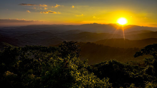 Scenic view of sunset over mountains