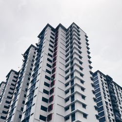 Low angle view of modern buildings against sky